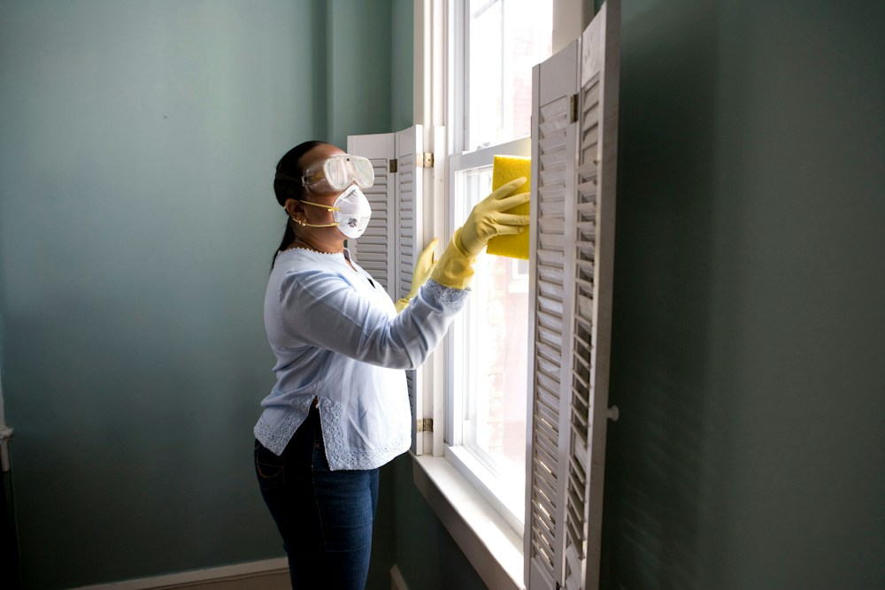 Pre and post event cleaning team sanitizing luxury kitchen and event venue